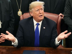 U.S. President Donald Trump speaks after signing H.R. 390, the "Iraq and Syria Genocide Relief and Accountability Act of 2018" in the Oval Office at the White House on December 11, 2018 in Washington, DC.
