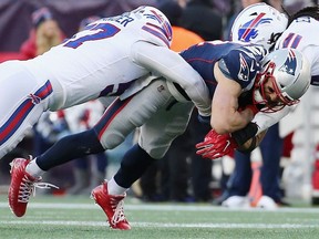 Julian Edelman #11 of the New England Patriots is tackled during the second half against the Buffalo Bills at Gillette Stadium on December 23, 2018 in Foxborough, Massachusetts.