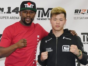 Floyd Mayweather Jr. (L) and Tenshin Nasukawa pose during a news conference at the Mayweather Boxing Club on December 6, 2018 in Las Vegas, Nevada. The two will meet in a three-round boxing exhibition at Saitama Prefecture Super Arena in Saitama, Japan on December 31, 2018.
