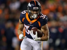 Phillip Lindsay of the Denver Broncos carries the ball against the Cleveland Browns at Broncos Stadium at Mile High on December 15, 2018 in Denver, Colorado.