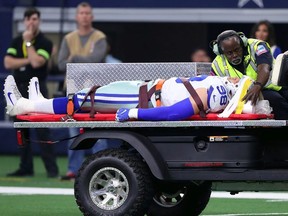 Tyrone Crawford of the Dallas Cowboys is carted off the field after an injury in the first quarter against the Tampa Bay Buccaneers at AT&T Stadium on December 23, 2018 in Arlington, Texas.