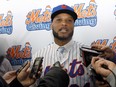 New York Mets' Robinson Cano answers questions at CitiField, in New York, Tuesday, Dec. 4, 2018. (AP Photo/Richard Drew)
