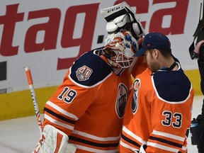 Edmonton Oilers goalie Cam Talbot (R) congratulates goalie Mikko Koskinen after defeating the Vegas Golden Knights during NHL action at Rogers Place in Edmonton, Dec. 1, 2018.