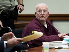 Father William Thomas Faucher waits to be wheeled back to prison after being sentenced to 25 years in prison without parole Thursday, Dec. 20, 2018, at the Ada County Courthouse in Boise, Idaho. (Darin Oswald/Idaho Statesman via AP)