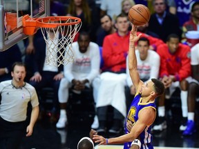 Steph Curry of the Golden State Warriors shoots under little pressure from Paul Pierce of the Los Angeles Clippers during their NBA game in Los Angeles, California on November 19, 2015 where the Warriors defeated the Clippers 124-117.