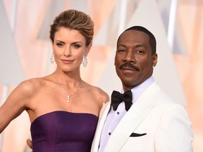 Paige Butcher, left, and Eddie Murphy arrive at the Oscars on Sunday, Feb. 22, 2015, at the Dolby Theatre in Los Angeles.