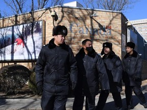 Chinese police patrol in front of the Canadian embassy in Beijing on December 13, 2018. - A second Canadian who had gone missing in China is under investigation on suspicion of "engaging in activities that harm China's national security", state media reported on December 13. Security has been stepped up outside the embassy since Meng Wanzhou, the chief financial officer of Chinese telecom giant Huawei, was arrested in Canada, at Washington's request.
