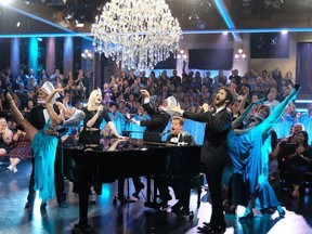This Sept. 26, 2018 image released by CBS shows Sophie Turner, left, and Josh Groban, right, performing "Baby Shark" with host James Corden on "The Late Late Show with James Corden," in Los Angeles.