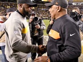 Pittsburgh Steelers head coach Mike Tomlin, left, greets Cincinnati Bengals head coach Marvin Lewis after an NFL football game, Sunday, Dec. 30, 2018, in Pittsburgh.