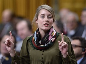 Minister of Tourism, Official Languages and La Francophonie Melanie Joly rises during Question Period in the House of Commons on Parliament Hill in Ottawa on Nov. 26, 2018. Joly's office says Canada and China have mutually agreed to postpone a closing ceremony next week to mark a year of tourism between the two countries.