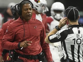 FILE - In this Dec. 16, 2018, file photo Arizona Cardinals head coach Steve Wilks speaks to field judge Rick Patterson (15) during the first half of an NFL football game in Atlanta. The Arizona Cardinals have fired Wilks after just one season as head coach. Wilks' firing Monday, Dec. 31 followed a 3-13 season, the franchise's worst record in 18 years and the worst in the NFL this season.