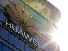 The logo of Huawei stands on its office building at the research and development centre in Dongguan in south China's Guangdong province, Tuesday, Dec. 18, 2018.