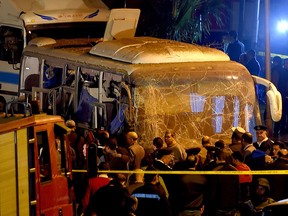 This picture taken on December 28, 2018 shows officials visiting the scene of an attack on a tourist bus in Giza province south of the Egyptian capital Cairo. (MOHAMED EL-SHAHED/AFP/Getty Images)