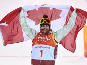 Canada's Mikael Kingsbury celebrates after winning the men's moguls at the 2018 Winter Olympic Games at Phoenix Snow Park in Pyeongchang, South Korea, on Feb. 12, 2018. /