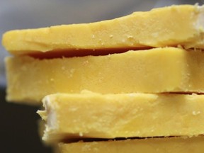 This May 28, 2015 file photo shows cheddar cheese Madison, Wis.