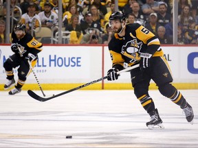 Pittsburgh Penguins  Kris Letang controls the puck in Game Four of the Eastern Conference Second Round during the 2018 NHL Stanley Cup Playoffs against the Washington Capitals at PPG PAINTS Arena on May 3, 2018 in Pittsburgh. (Kirk Irwin/Getty Images)