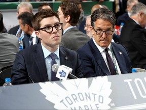 Kyle Dubas, left, and Brendan Shanahan of the Toronto Maple Leafs handle the draft table during the 2018 NHL Draft at American Airlines Center on June 23, 2018 in Dallas, Texas. (Bruce Bennett/Getty Images)