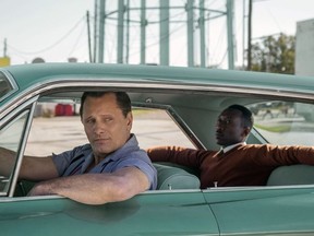 This image released by Universal Pictures shows Viggo Mortensen, left, and Mahershala Ali in a scene from "Green Book." On Thursday, Dec. 6, 2018, the film was nominated for a Golden Globe award for best motion picture musical or comedy. The 76th Golden Globe Awards will be held on Sunday, Jan. 6. (Patti Perret/Universal Pictures via AP) ORG XMIT: NYET806