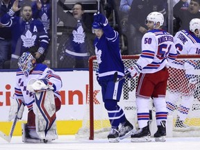 Toronto Maple Leafs right wing Mitchell Marner (16) celebrates Morgan Rielly's goal against New York Rangers goaltender Alexandar Georgiev (40) during third period NHL hockey action in Toronto on Saturday, December 22, 2018.