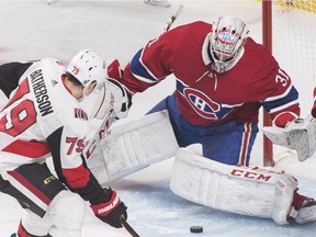 Ottawa Senators' Drake Batherson is stopped by Canadiens goaltender Carey Price in Montreal on Saturday, Dec. 15, 2018.