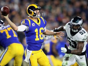 Rams quarterback Jared Goff (16) passes the ball under pressure from Eagles' Nigel Bradham (53) during second half NFL action at Los Angeles Memorial Coliseum on Sunday, Dec. 16, 2018.