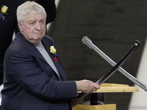 In this Tuesday, Nov. 8, 2011, file photo, Buffalo Sabres Hall of Fame Class of 2012 inductee Rick Jeanneret helps salute the crowd in Buffalo, N.Y. (AP Photo/David Duprey, File)