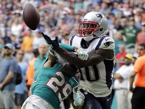 Miami Dolphins free safety Minkah Fitzpatrick (29) interferes with a pass intended for New England Patriots wide receiver Josh Gordon (10) Sunday, Dec. 9, 2018, in Miami Gardens, Fla. (AP Photo/Lynne Sladky)