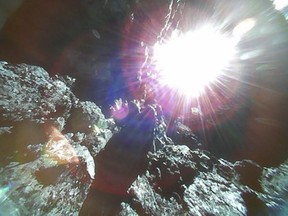 This Oct. 26, 2018, image captured by Rover-1A, and provided by the Japan Aerospace Exploration Agency (JAXA) on Thursday, Dec. 13, 2018, shows the surface of asteroid Ryugu. Japan's space agency JAXA said Thursday, Dec. 13, 2018, more than 200 photos taken by two small rovers on the asteroid show no signs of a smooth area for the planned touchdown of a spacecraft early next year. (JAXA via AP)