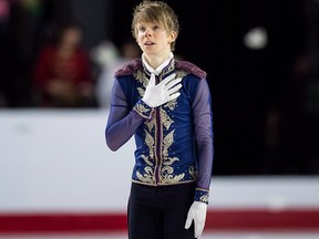 Kevin Reynolds, of Coquitlam, B.C., pauses on the ice after performing his free program during the senior men's competition at the Canadian Figure Skating Championships in Vancouver on January 13, 2018. (THE CANADIAN PRESS/Darryl Dyck)