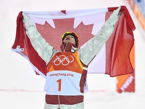 Canadian Mikael Kingsbury celebrates after winning the men's moguls at the 2018 Winter Olympic Games at Phoenix Snow Park in Pyeongchang, South Korea, Monday, Feb. 12, 2018. (THE CANADIAN PRESS/Jonathan Hayward)