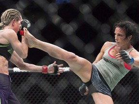 Valerie Letourneau, from Canada, right, lands a kick to the head of Jessica Rakoczy, from Canada, during their UFC 186 fight in Montreal on April 25, 2015.