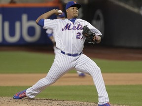 In this May 18, 2018, file photo, New York Mets pitcher Jeurys Familia (27) delivers against the Arizona Diamondbacks in New York.