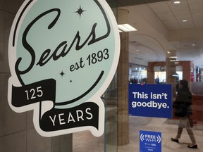 In this Nov. 2, 2018 photo, a sign in the window at Sears promises that "This isn't goodbye," at the Livingston Mall in Livingston, N.J.