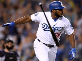 Yasiel Puig of the Los Angeles Dodgers tosses his bat after homering at Dodger Stadium on September 19, 2018 in Los Angeles. (Harry How/Getty Images)