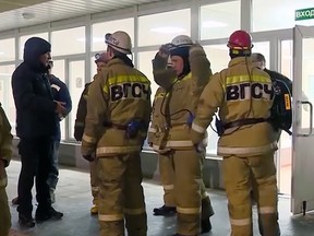 In this video grab provided by RU-RTR Russian television, a Russian rescue team prepares to go down into the potash mine in Solikamsk Sunday, Dec. 23, 2018. (RU-RTR Russian Television via AP)