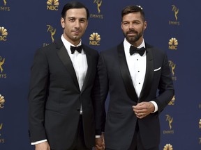 In this Sept. 17, 2018, file photo, Jwan Yosef, left, and Ricky Martin arrive at the 70th Primetime Emmy Awards at the Microsoft Theater in Los Angeles. Martin announced the arrival of his daughter with an Instagram post showing off the infants tiny hands.