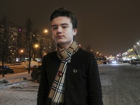 In this photo taken on Wednesday, Dec. 19, 2018, high school student Maxim Dautov poses for a picture in St. Petersburg, Russia. (AP Photo/Nataliya Vasilyeva)