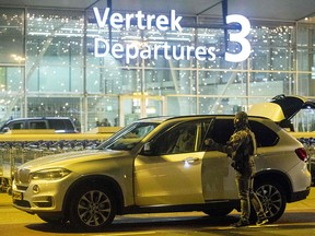 A Dutch military police officer arrives at Schiphol airport on December 31, 2018, after it was temporarily closed following threats by an unknown man that he was carrying a bomb. (NIELS WENSTEDT/AFP/Getty Images)
