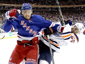 Kevin Shattenkirk of the New York Rangers shoves Darnell Nurse of the Edmonton Oilers during their game at Madison Square Garden on November 11, 2017 in New York. (Abbie Parr/Getty Images)