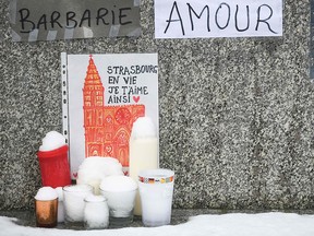 A drawing depicting the Strasbourg Cathedral reading "Strasbourg alive, this is how I love you" is pictured during a gathering around a makeshift memorial at Place Kleber, in Strasbourg, on December 16, 2018. (Getty Images)