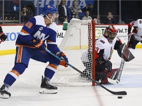 Ottawa Senators goaltender Mike McKenna defends against New York Islanders center Brock Nelson (29) during the second period of an NHL hockey game, Friday, Dec. 28, 2018, in New York.