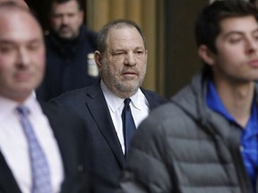 Harvey Weinstein, center, leaves New York Supreme Court, Thursday, Dec. 20, 2018, in New York.