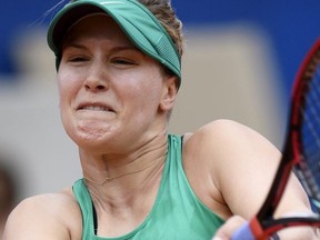 Eugenie Bouchard of Canada returns a ball to Veronika Kudermetova of Russia during their quarter-finals game at the WTA Ladies Championship tennis tournament in Gstaad, Switzerland, Friday, July 20, 2018. (Anthony Anex/Keystone via AP)