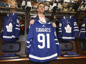 Toronto Maple Leafs forward John Tavares stands at his stall in the locker room with his new jersey. (Jack Boland/Toronto Sun)