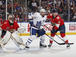 Maple Leafs centre John Tavares stands his ground in front of Florida Panthers goalie Roberto Luongo on Saturday night. Tavares says Toronto is trying to make adjustments to its flagging power play. (Joel Auerbach/Getty Images)