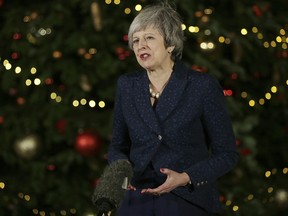 British Prime Minister Theresa May makes a statement outside 10 Downing Street, in London, Wednesday December 12, 2018. (AP Photo/Tim Ireland)
