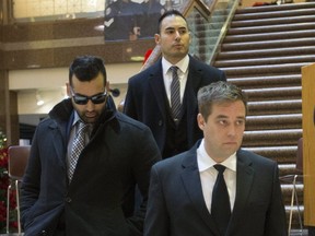 Toronto Police Consts. (l-r) Sameer Kara, Joshua Cabero and Leslie Nyznik leave a disciplinary hearing on Thursday, Dec. 13, 2018 at police headquarters.