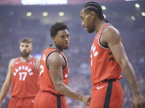 Raptors forward Kawhi Leonard (right) and teammeate Raptors guard Kyle Lowry have appeared in just four games tonight in December.  Veronica Henri/Toronto Sun