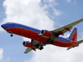 In this Aug. 26, 2016, file photo, a Southwest Airlines jet makes its approach to Dallas Love Field airport, in Dallas.