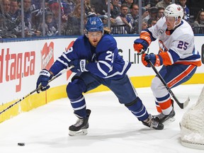 Maple Leafs forward William Nylander carries the puck against the New York Islanders on Saturday night at Scotiabank Arena. Nylander has just two assists since ending his contract holdout at the start of December. (Claus Andersen/Getty Images)